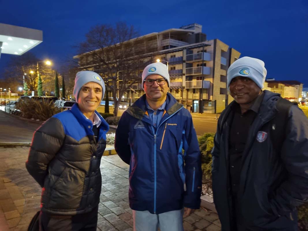 David Barrett and Shaun Evans bundled up with Adele Pedder from Keep Top End Coasts Healthy on the Nipaluna waterfront. 